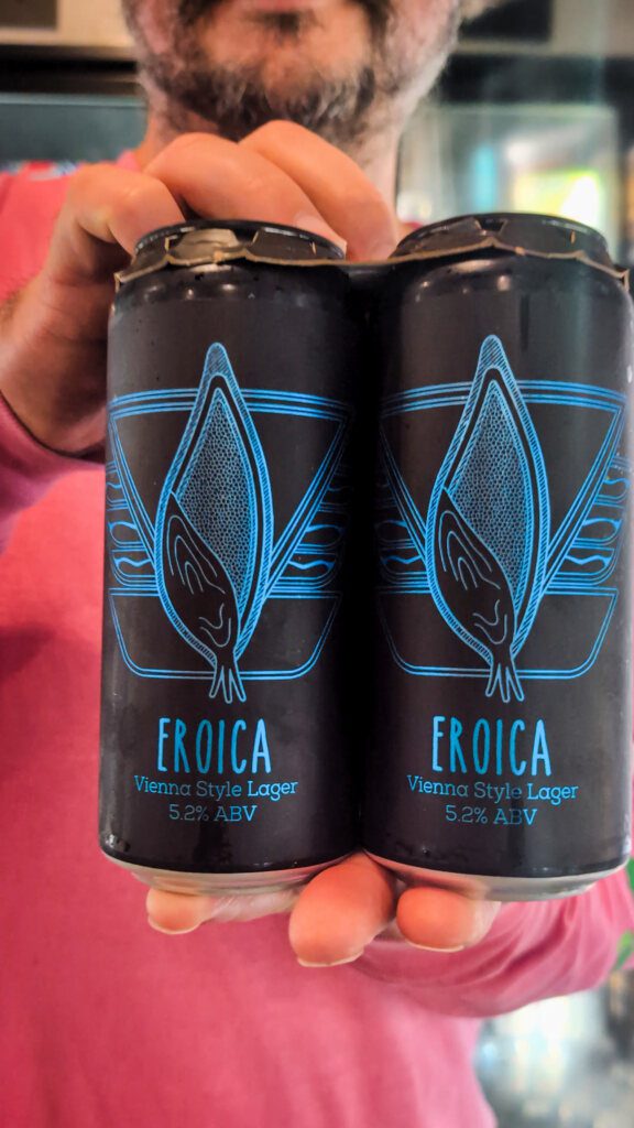 dude holding eroica cans lost gen brew shop